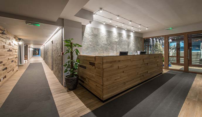 A modern hotel lobby and reception counter