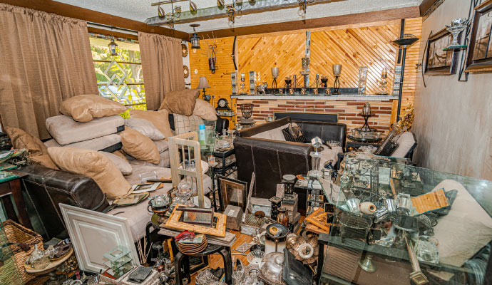 Room severely affected by hoarding disorder, filled with excessive clutter and accumulated items