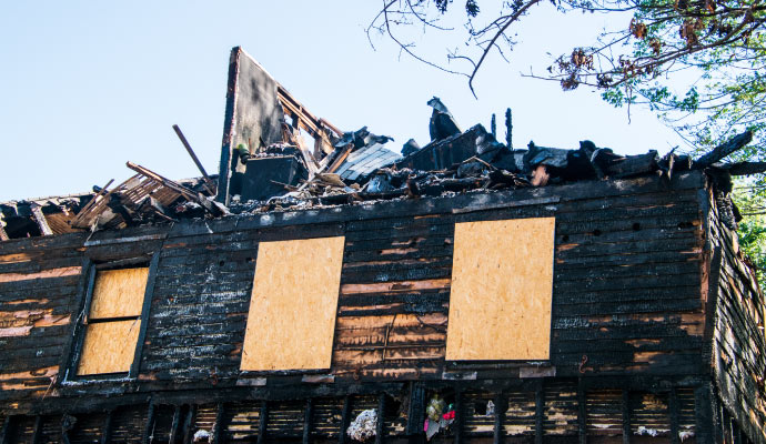 Board up fire damage house
