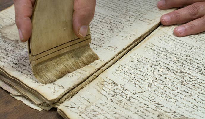 A person is restoring document