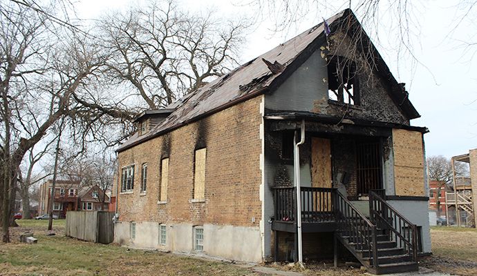 Fire damaged house board up service