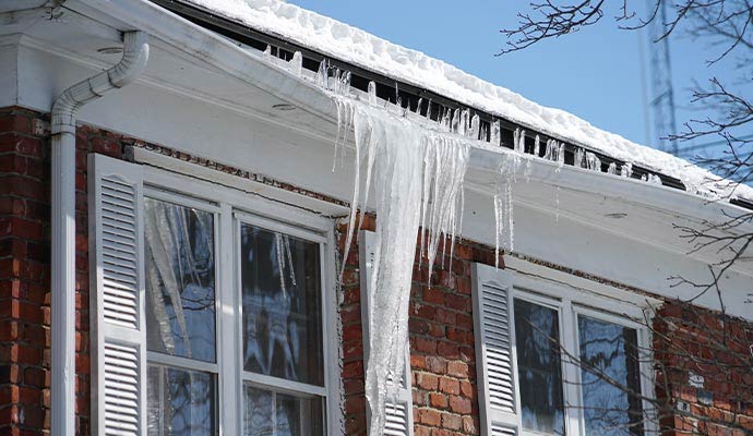 Heavy snow and ice damaged roof