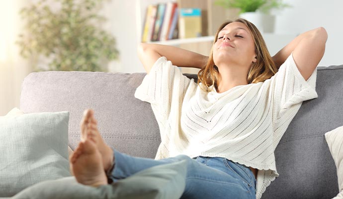 Person relaxing in room Person relaxing in room