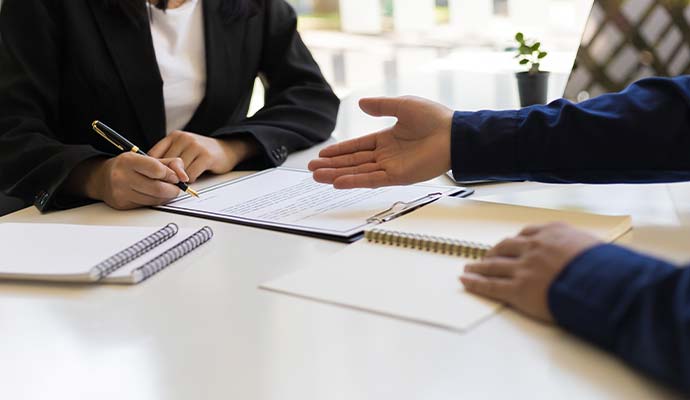 Person signing insurance documents