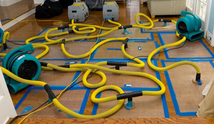 Water damage floor restoration using professional equipment